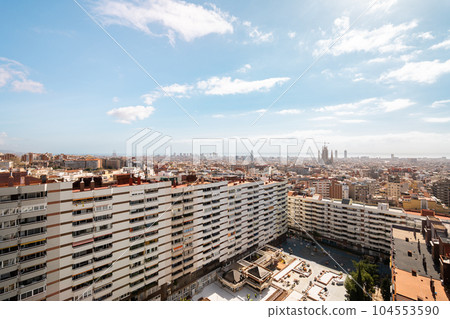 Cityscape of barcelona's urban area with skyline and architectural buildings in high angle view Cityscape of barcelona's urban area with skyline and architectural buildings in high angle view 104553590