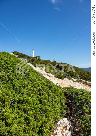 Lefkada island lighthouse on sea shore green cliff Lefkada island lighthouse on sea shore green cliff 104553743
