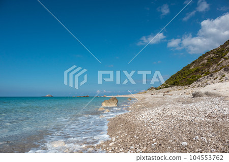 Pebble sunny beach on Lefkada island in Greece 104553762