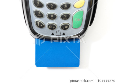 Credit card in payment terminal on white background 104555870