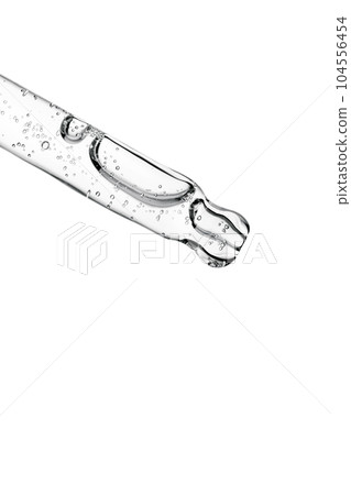 Transparent pipette with cosmetics on a white isolated background. 104556454