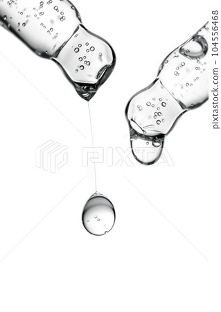 Transparent pipettes with cosmetics on a white isolated background. Transparent pipettes with cosmetics on a white isolated background. 104556468