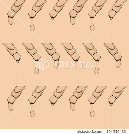 Three rows with pipettes with serum or other cosmetic product. Three rows with pipettes with serum or other cosmetic product. 104556483