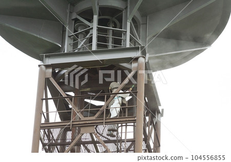 Sandblasting process. Cleaning the metal construction surface from rust before painting. Anticorrosive metal protection. Sandblasting process. Cleaning the metal construction surface from rust before painting. Anticorrosive metal protection. 104556855