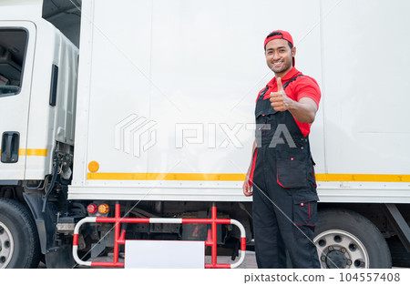 Portrait of Asian delivery man stand beside of truck and show thumbs up also look at camera Portrait of Asian delivery man stand beside of truck and show thumbs up also look at camera 104557408
