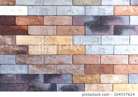 multicolored brick wall, masonry. Abstraction, texture multicolored brick wall, masonry. Abstraction, texture 104557624