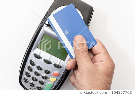Hand make payment with credit card with NFC contactless technology on terminal device. White background Hand make payment with credit card with NFC contactless technology on terminal device. White background 104557708