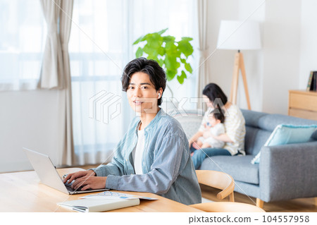 A young man doing telework in the living room 104557958