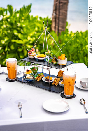 Afternoon tea in Lamai beach resort in Koh Samui, Thailand Afternoon tea in Lamai beach resort in Koh Samui, Thailand 104558394
