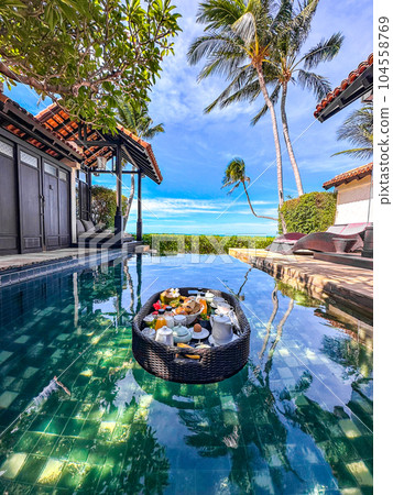 Floating breakfast in pool in Lamai beach resort in Koh Samui, Thailand 104558769