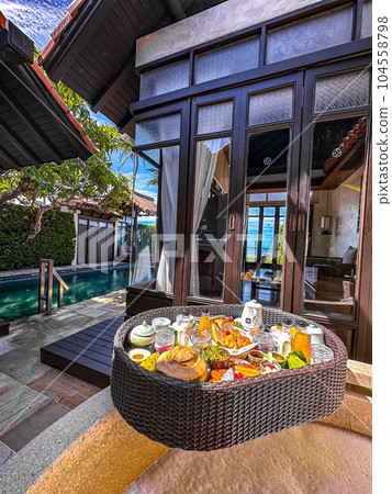 Floating breakfast in pool in Lamai beach resort in Koh Samui, Thailand 104558798