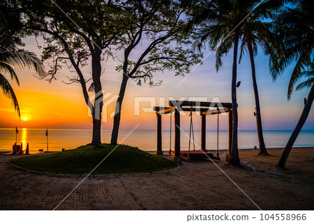 Beachfront sunrise with pool and palm trees in Hua Hin, Prachuap Khiri Khan, Thailand Beachfront sunrise with pool and palm trees in Hua Hin, Prachuap Khiri Khan, Thailand 104558966