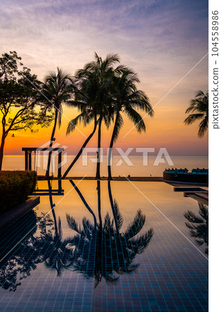Beachfront sunrise with pool and palm trees in Hua Hin, Prachuap Khiri Khan, Thailand 104558986