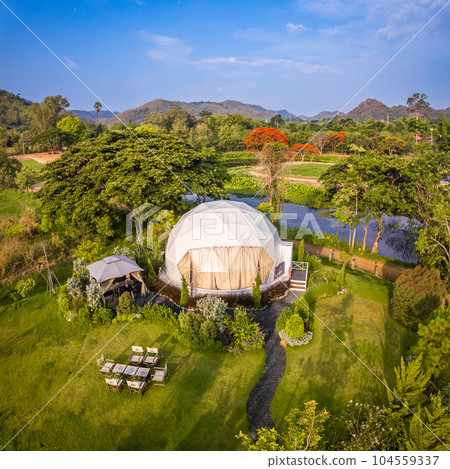 Aerial view of a glamping or camping area with tents in Khao Yai, Nakhon Ratchasima, Thailand Aerial view of a glamping or camping area with tents in Khao Yai, Nakhon Ratchasima, Thailand 104559337