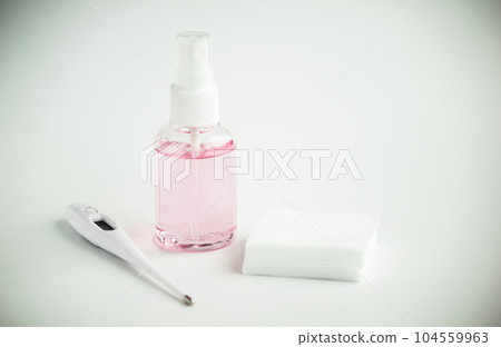 Protecting health from bacteria and viruses. Hand sanitizer, face mask and body thermometer. Protecting health from bacteria and viruses. Hand sanitizer, face mask and body thermometer. 104559963