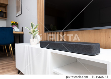 Soundbar in a modern home. Listening to music Soundbar in a modern home. Listening to music 104560281