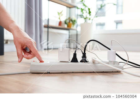 Electrical plug in outlet socket at home 104560304