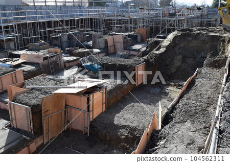 Building foundation construction site under construction Building foundation construction site under construction 104562311