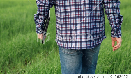 man laptop boots, walking green field wheat, male farmer laptop, agriculture, work countryside senior farmer, agricultural technician engineer walks through field summer day, farm wheat, nature summer man laptop boots, walking green field wheat, male farmer laptop, agriculture, work countryside senior farmer, agricultural technician engineer walks through field summer day, farm wheat, nature summer 104562432