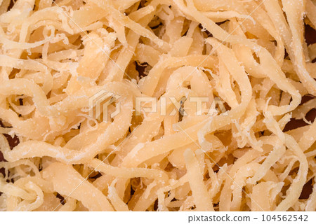 Delicious dried squid in the form of shavings with salt and spices 104562542