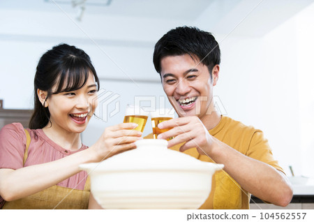 Young couple toasting with beer 104562557