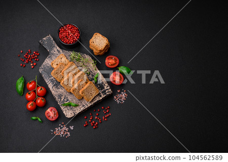 Delicious salted rectangular wheat croutons with salt and spices 104562589