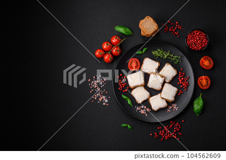 Delicious salty rectangular wheat croutons with cream cheese, tomatoes, salt and spices Delicious salty rectangular wheat croutons with cream cheese, tomatoes, salt and spices 104562609
