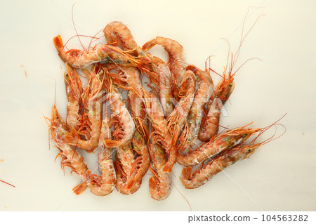 frosted king prawns closeup photo on white table background  104563282
