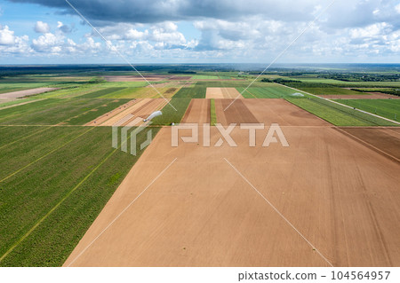 Aerial view of planted and unplanted agricultural fields in Homestaed, Florida. 104564957