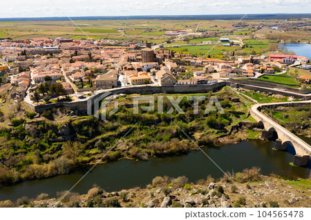Drone view of Ledesma townscape on banks of Tormes river, Spain Drone view of Ledesma townscape on banks of Tormes river, Spain 104565478