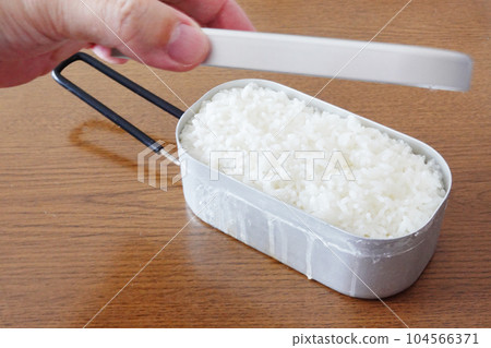Rice cooked in a small rectangular aluminum pot "Mestin" Rice cooked in a small rectangular aluminum pot "Mestin" 104566371