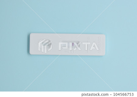 covid test kit on blue background covid test kit on blue background 104566753