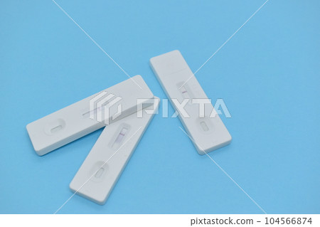 covid test kit on blue background covid test kit on blue background 104566874