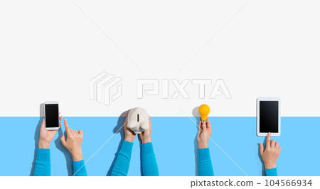 Technology devices and a piggy bank 104566934