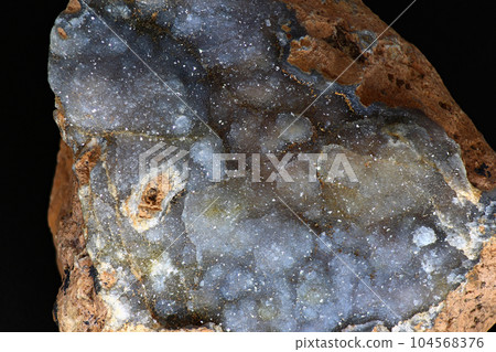 Fine crystalline quartz brush on chalcedony close up 104568376