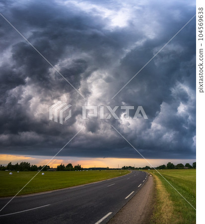 Storm cloud influenced by Climate change. Dangerous storm cloud spinning fast Storm cloud influenced by Climate change. Dangerous storm cloud spinning fast 104569638