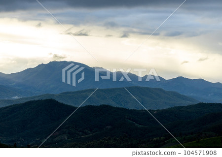 Top view Landscape of Morning Mist with Mountain Layer at north of Thailand. mountain ridge and clouds in rural jungle bush forest Top view Landscape of Morning Mist with Mountain Layer at north of Thailand. mountain ridge and clouds in rural jungle bush forest 104571908