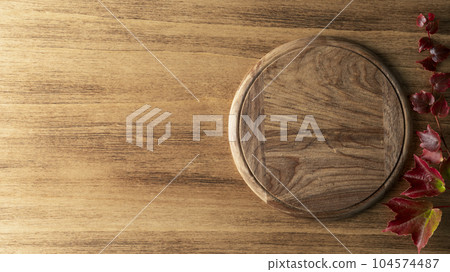 Thanksgiving background with leaves and round board 104574487