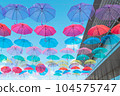Blue sky and many colorful umbrellas 104575747