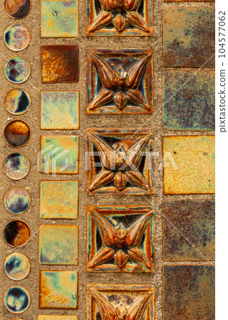 Ornament on the walls of a beautiful historical building in historical Cetinje, Montenegro, until 1916 the French Embassy was located in this building 104577062