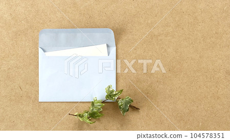 Opened light blue envelope and ivy_right space Opened light blue envelope and ivy_right space 104578351