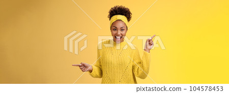 Energized active charismatic african-american woman afro hairstyle in sweater headband screaming fascinated enthusiastic pointing left right impressed variaty awesome choices, picking products 104578453