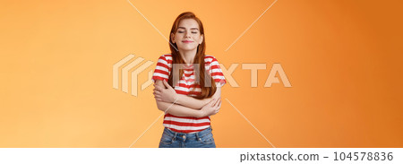 Tender lovely redhead modern woman embrace own body, feel happiness self-acceptance, smiling close eyes, cross arms, hugging herself dreamy, imaging something, daydreaming orange background Tender lovely redhead modern woman embrace own body, feel happiness self-acceptance, smiling close eyes, cross arms, hugging herself dreamy, imaging something, daydreaming orange background 104578836