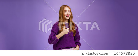 Girl approves great effort of coworker cheering and being supportive. Friendly-looking attractive nice redhead woman smiling broadly, thrilled showing thumbs up in like and positive reaction 104578859