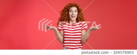 Unaware carefree clueless attractive redhead woman curly hairstyle shrugging unaware hands spread sideways smiling uncertain asking question friend intriguing how she so beautiful Unaware carefree clueless attractive redhead woman curly hairstyle shrugging unaware hands spread sideways smiling uncertain asking question friend intriguing how she so beautiful 104578903