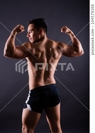 Muscular and torso of young man having abs, bicep and chest. Male hunk with athletic body. Muscular and torso of young man having abs, bicep and chest. Male hunk with athletic body. 104579168
