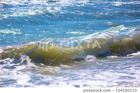The sea is stormy. Sea of Azov. Water edge, sea, wave, storm - marine natural background. Birds seagulls on the sea coast, a beach 104580319