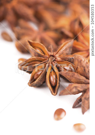 anisetree anise. Spices and dry herbs. Whole Star Anise isolated on white background anisetree anise. Spices and dry herbs. Whole Star Anise isolated on white background 104580353