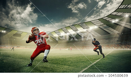 Dynamic image of sportsmen, american football players in uniform, in motion during game running at 3D stadium with ball. Dynamic image of sportsmen, american football players in uniform, in motion during game running at 3D stadium with ball. 104580639