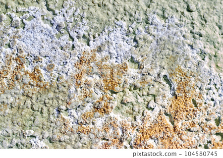 Dirty plastered wall with layers of paint, fungus and mold 104580745